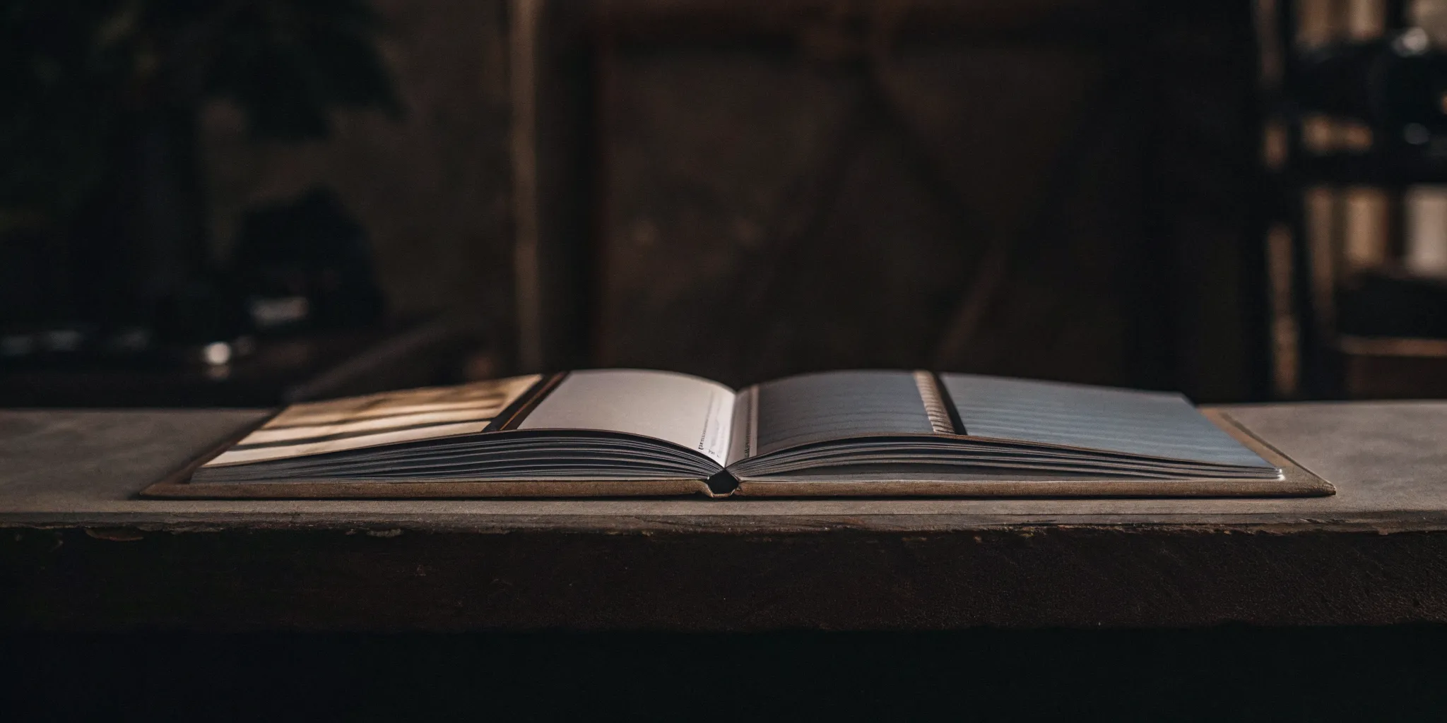 An open booklet laying flat, showing the center staples of its saddle stitch binding.